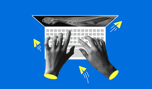Hands on a laptop keyboard.